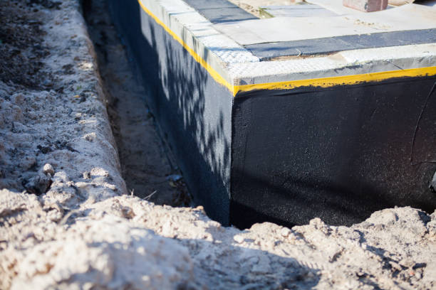Professional Waterproofing technician working in Fayetteville, NY